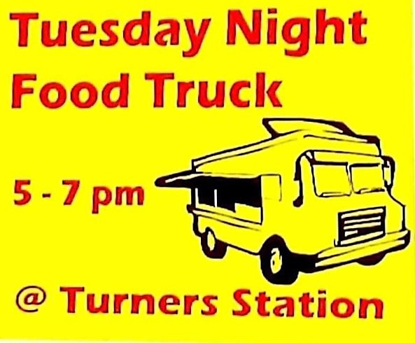 Yellow sign with food truck drawing, red writing reading 