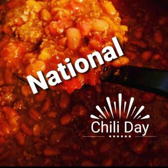 A pot of chili with National Chili Day written across it in white.