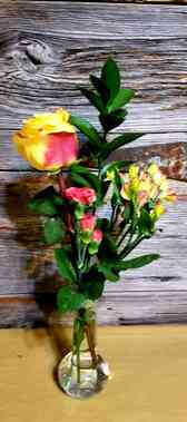 Yellow and pink flowers with greenery.